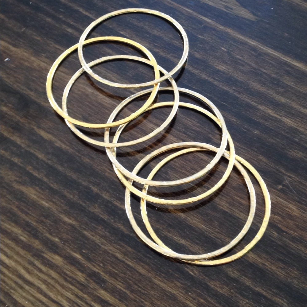 Set of 8 thin gold Toned bracelets